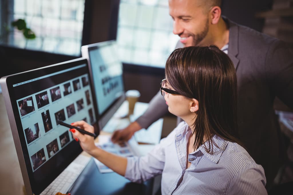 female magento developer looking at computer screen