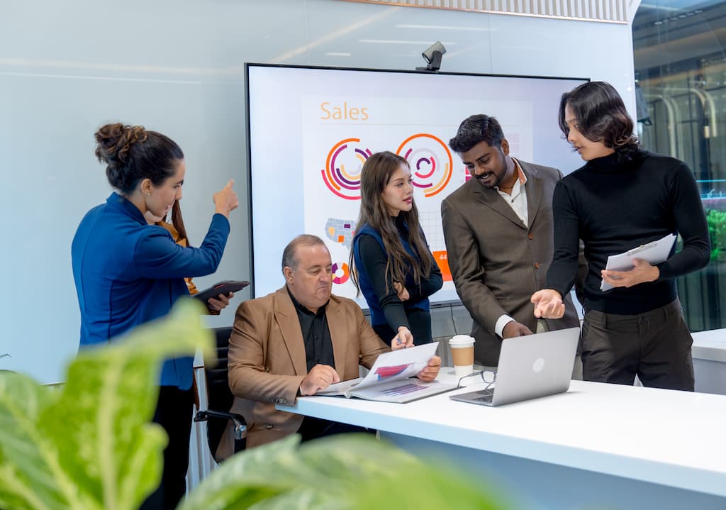 Employee's discussing plan to optimize SuiteCRM Theme